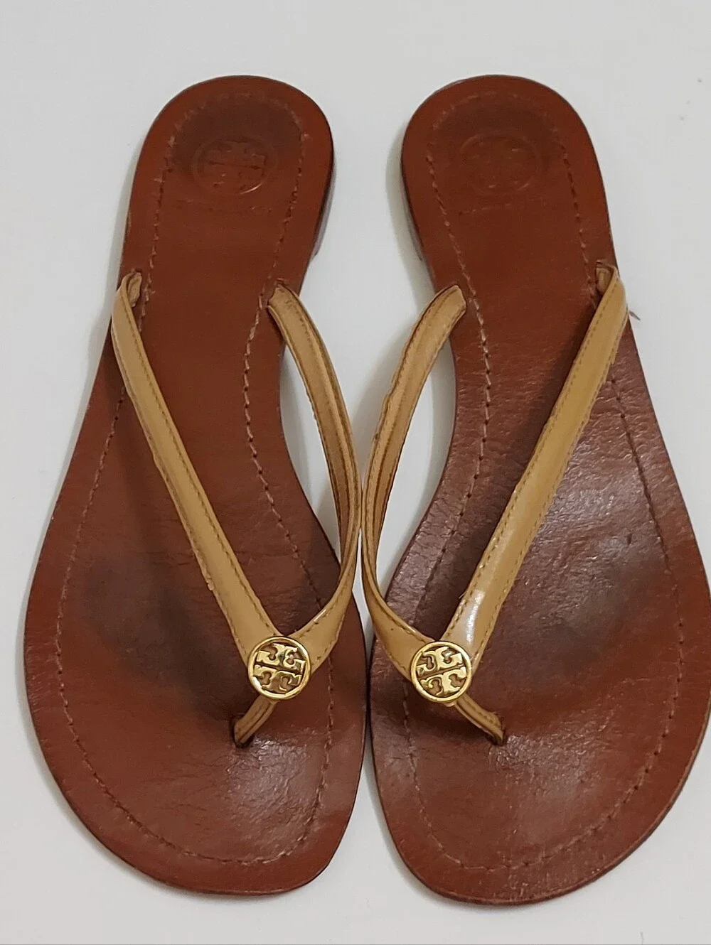 Tory Burch Brown Leather Flip Flop Sandals with Tan Straps and Gold Medallion
